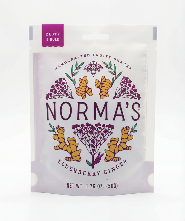 Norma's Elderberry Ginger fruit snack package front with floral herbal design on a white background. Zesty and bold flavor callout.